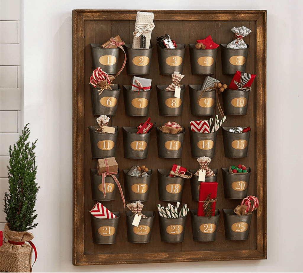 Pottery Barn Gilt Galvanized Advent Calendar, wood frame, wood backing, metal bins with numbers 1-25 labeled in gold ovals and white numbers.